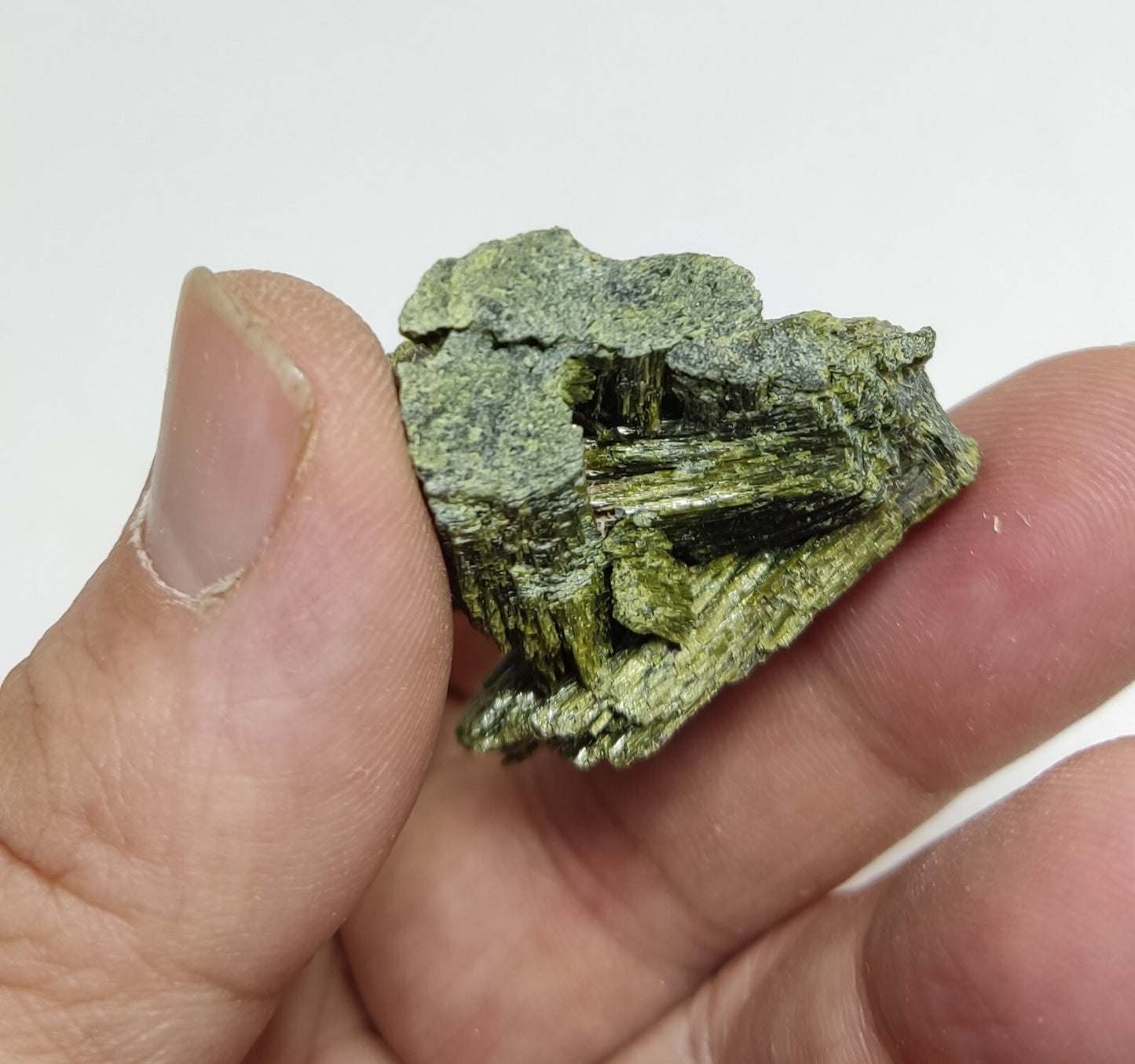 An aesthetic specimen of epidote crystal spray type 35 grams