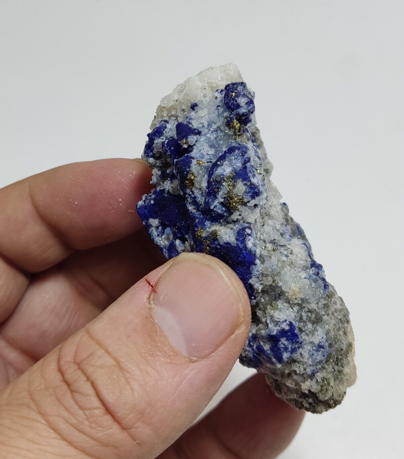 An Aesthetic specimen of fluorescent Lazurite with pyrite 112 grams