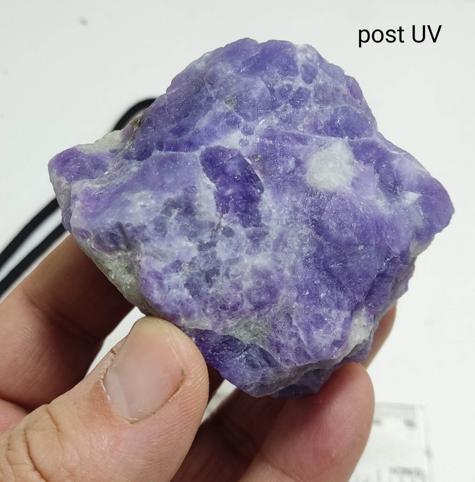 An amazing specimen of hackmanite highly Tenebrescent 143 grams