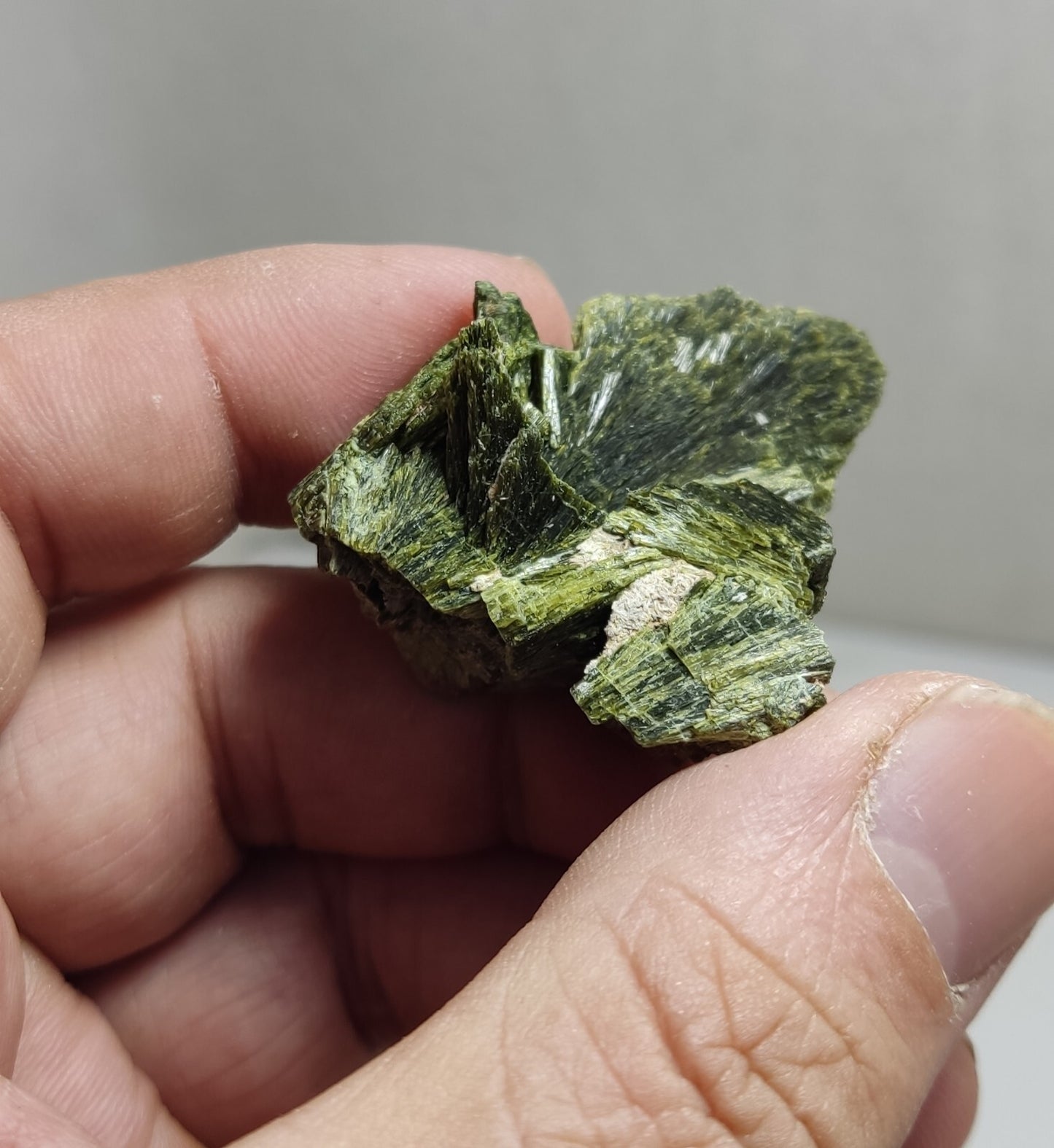 An aesthetic specimen of epidote crystal spray type 27 grams