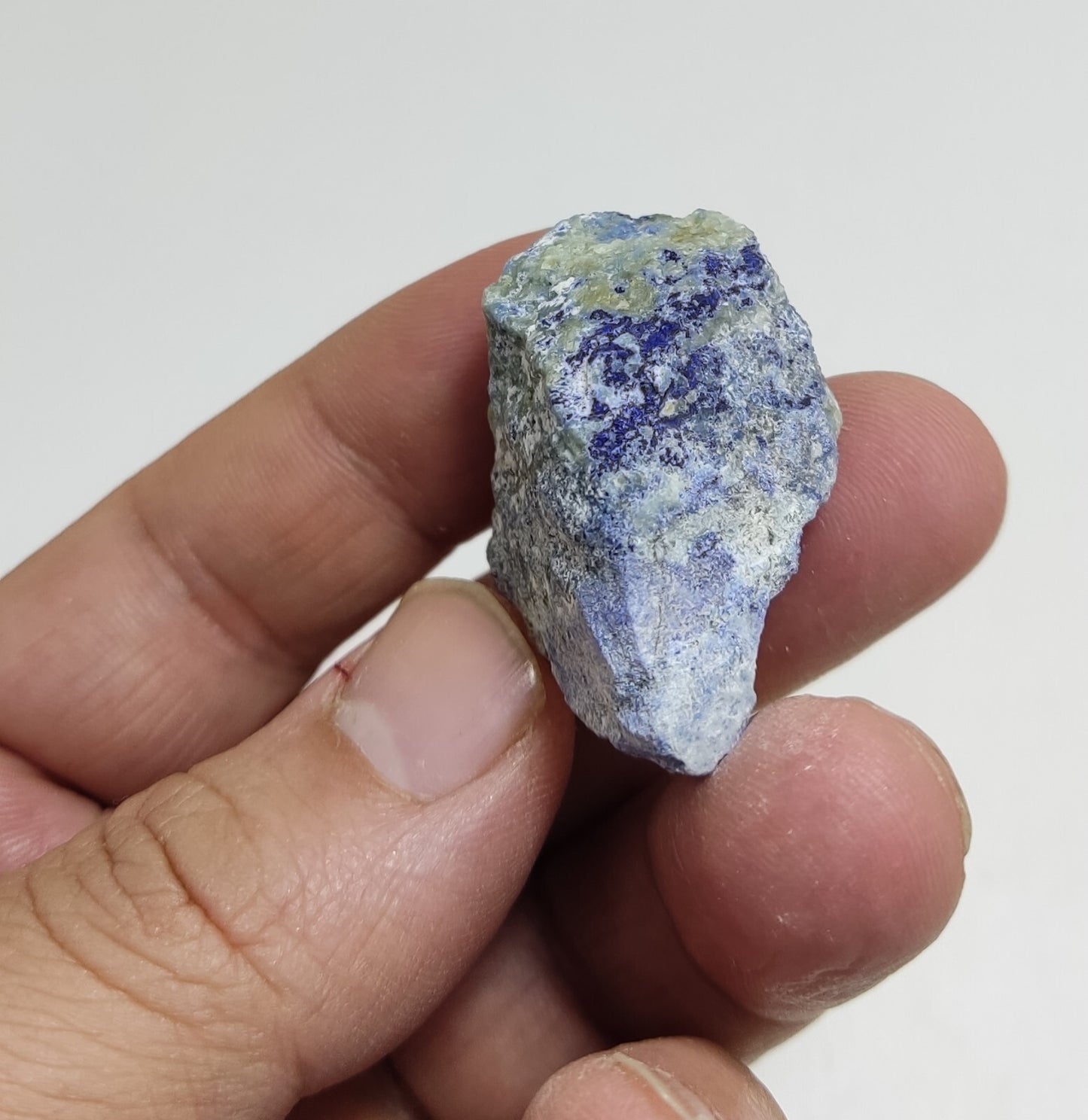 An Aesthetic specimen of fluorescent Lazurite with pyrite 25 grams