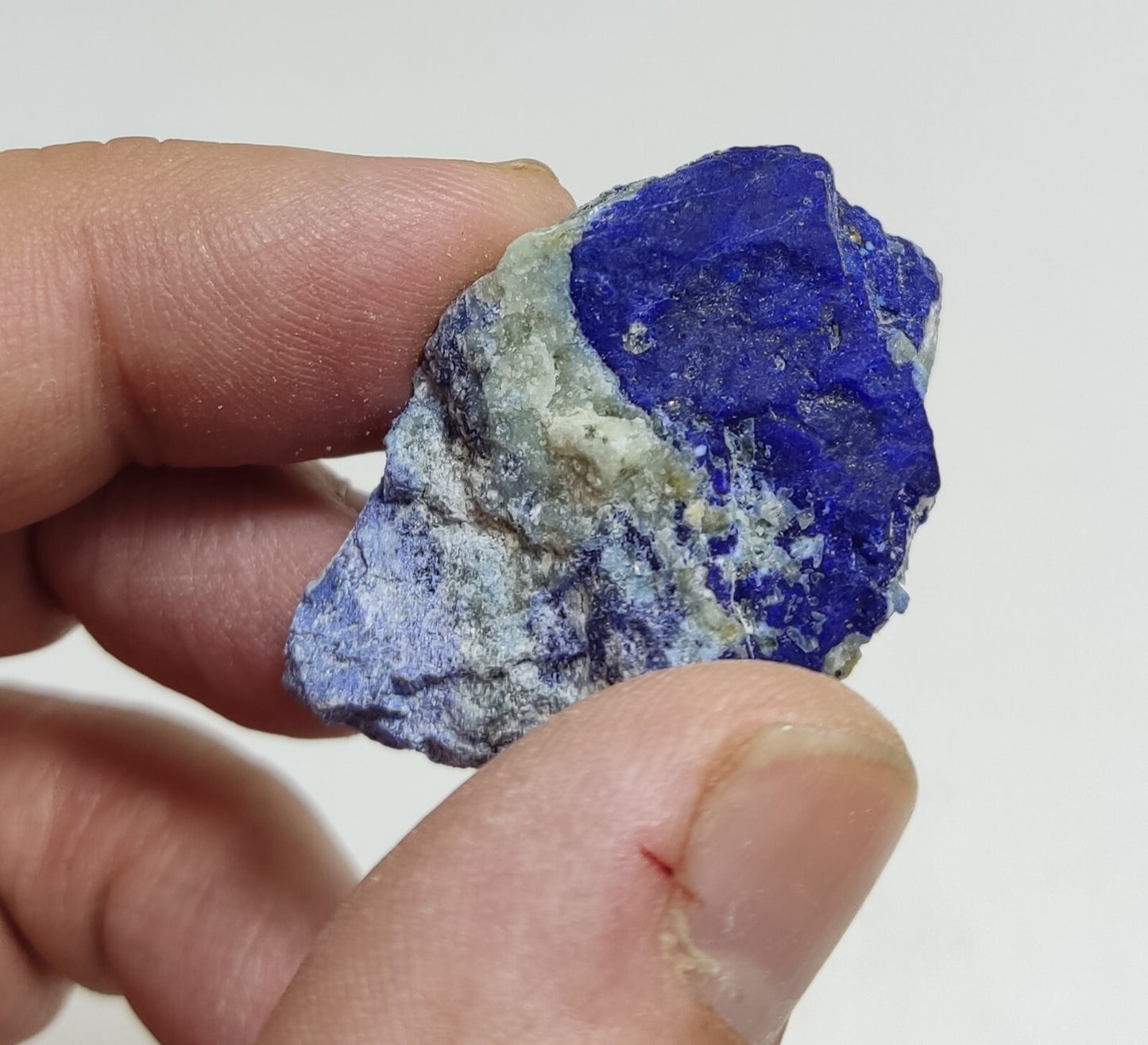 An Aesthetic specimen of fluorescent Lazurite with pyrite 25 grams