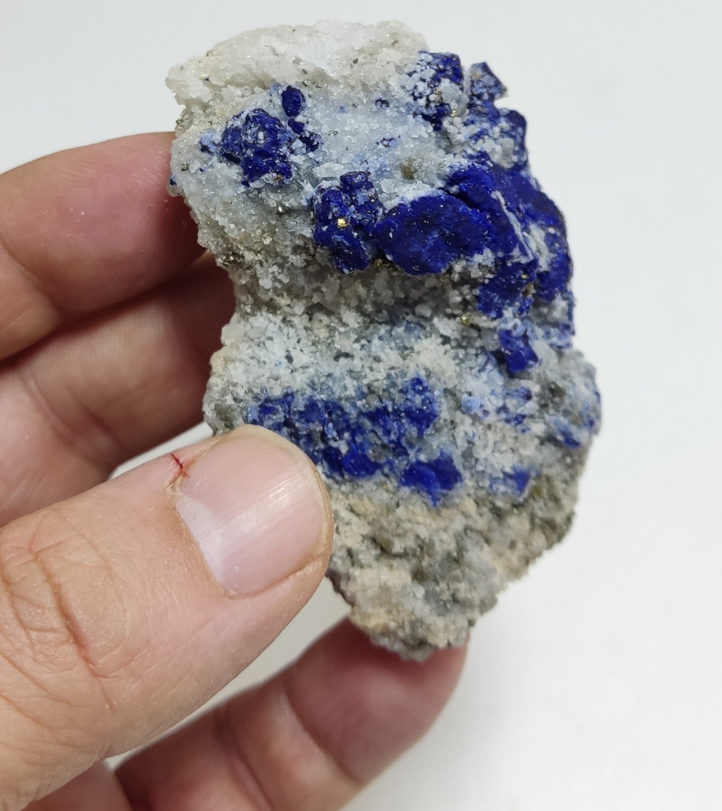 An Aesthetic specimen of fluorescent Lazurite with pyrite 112 grams