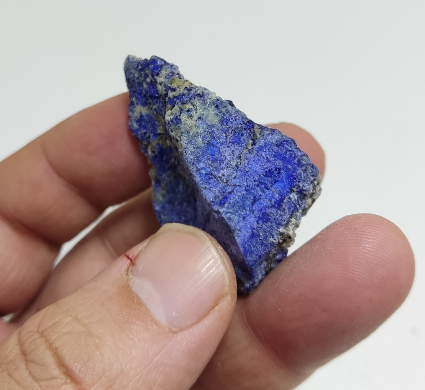 An Aesthetic specimen of fluorescent Lazurite with pyrite 27 grams