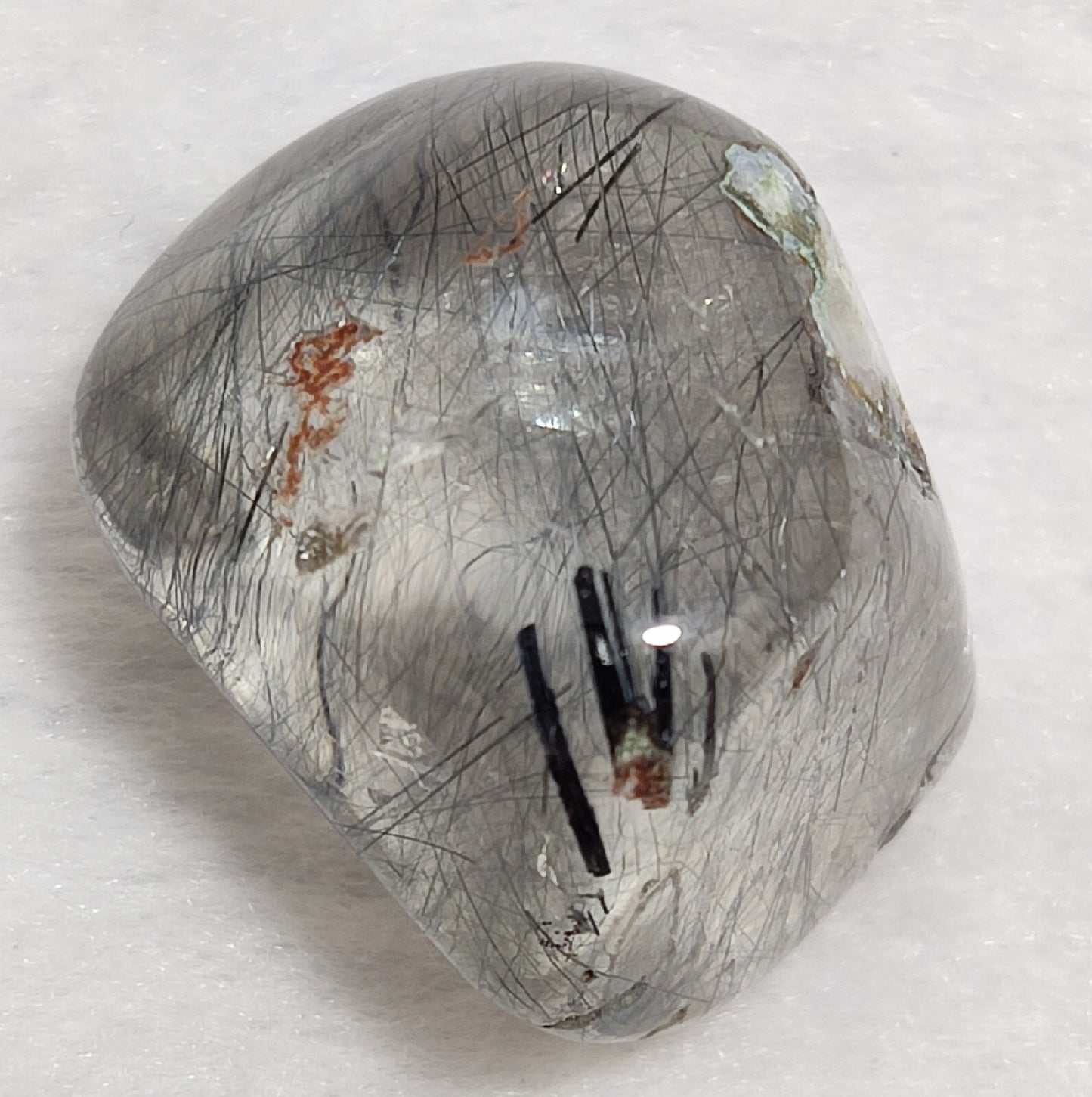 Single piece Rutiles/riebeckite/aegirine included quartz tumble 94 carats