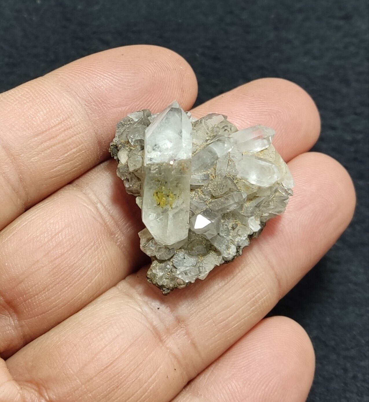 An Aesthetic quartz/calcite crystal specimen with petroleum inclusions 15 grams