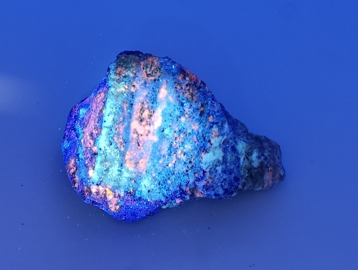 An Aesthetic specimen of fluorescent Lazurite with Pyrite 296 grams