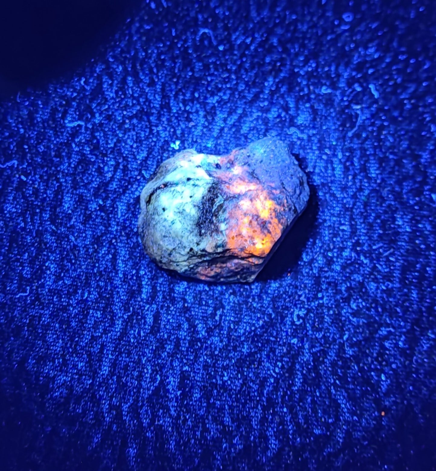 An Aesthetic specimen of fluorescent lapis/lazurite on matrix 23 grams