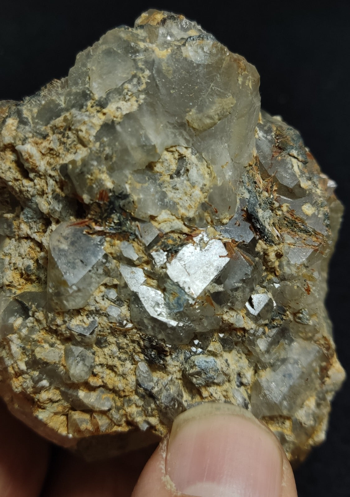 An Aesthetic terminated Quartz floater with rutiles and hematite 399 grams