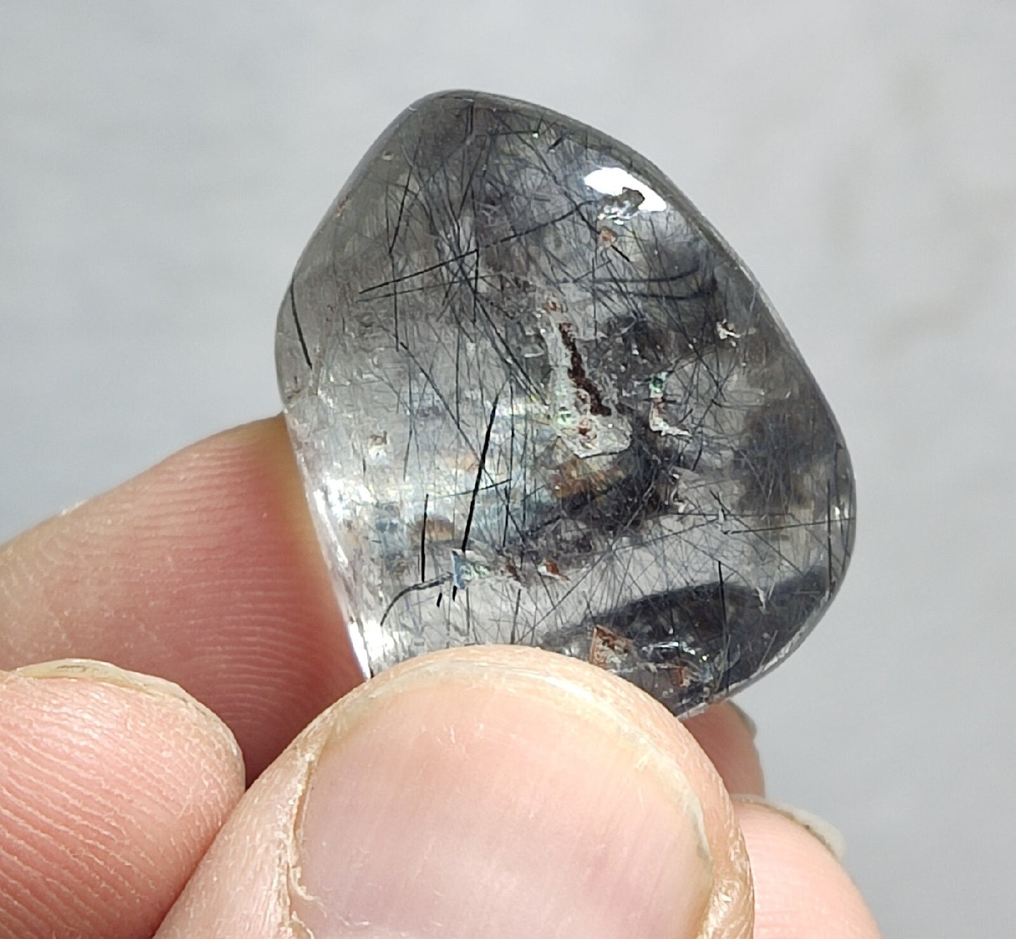 Single piece Rutiles/riebeckite/aegirine included quartz tumble 94 carats