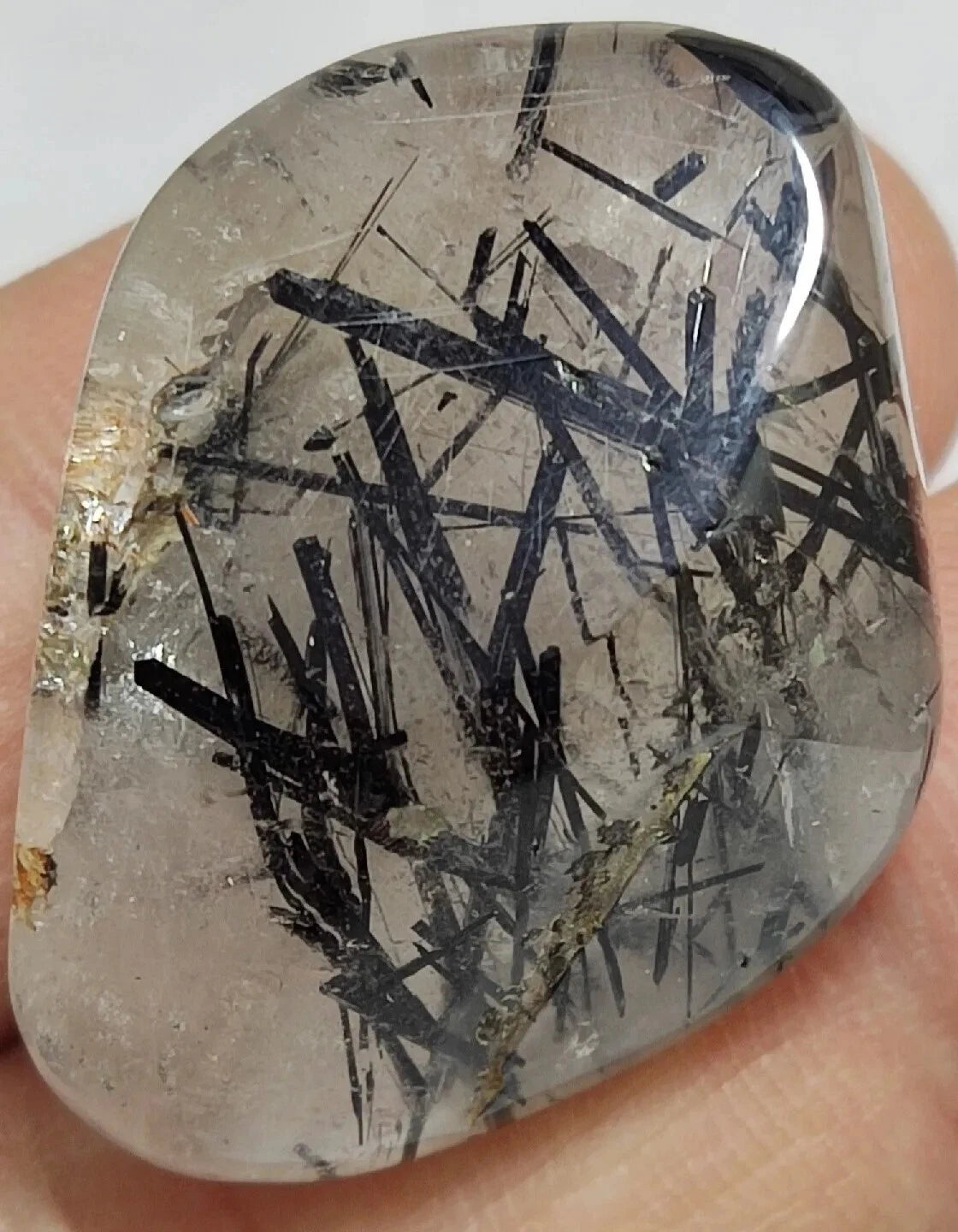 Rutiles/aegirine/ Unconfirmed quartz polished tumble 75 carats