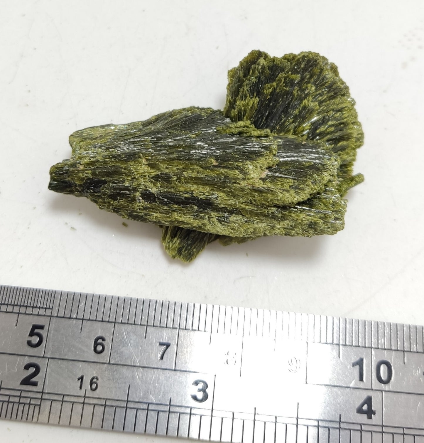 An aesthetic specimen of epidote crystal spray type 29 grams