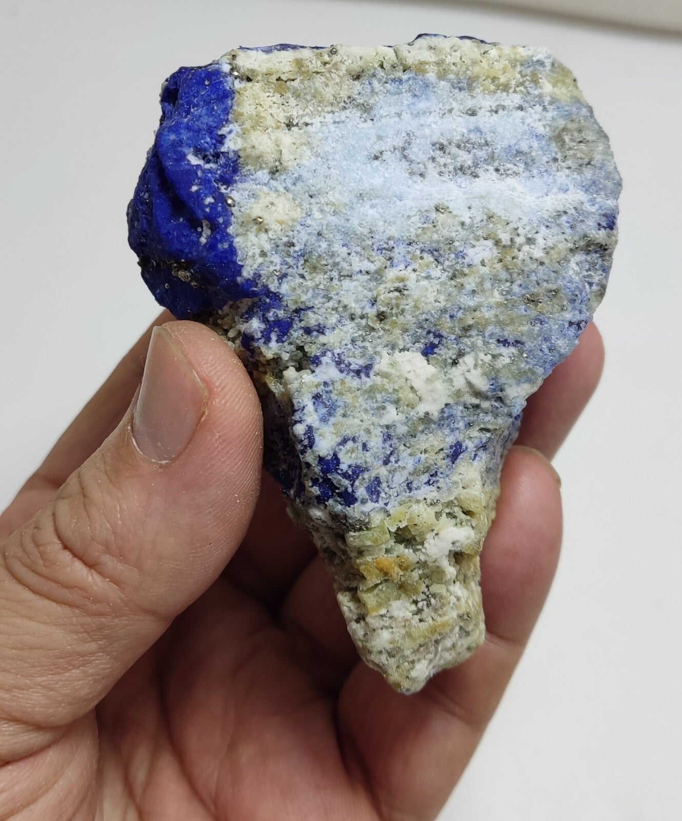 An Aesthetic specimen of fluorescent Lazurite with Pyrite 296 grams