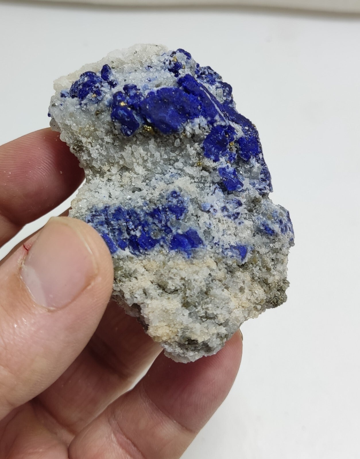 An Aesthetic specimen of fluorescent Lazurite with pyrite 112 grams