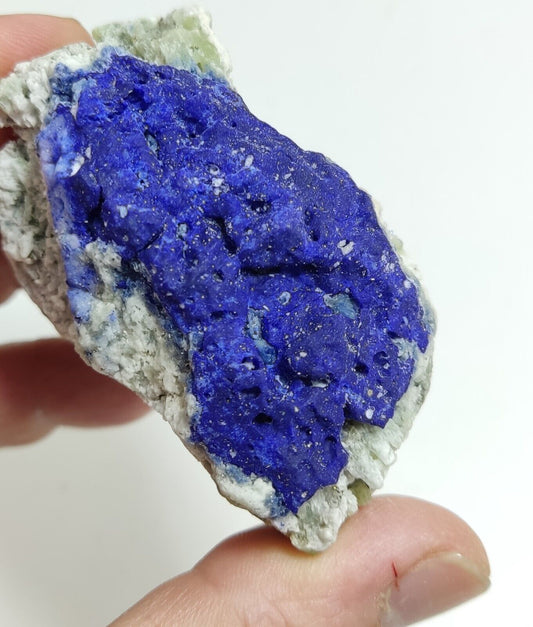 An Aesthetic specimen of fluorescent Lazurite with pyrite 181 grams
