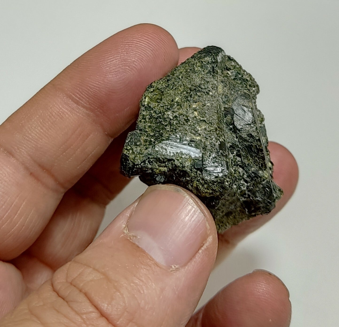 An aesthetic specimen of dark green color Epidote crystals 79 grams