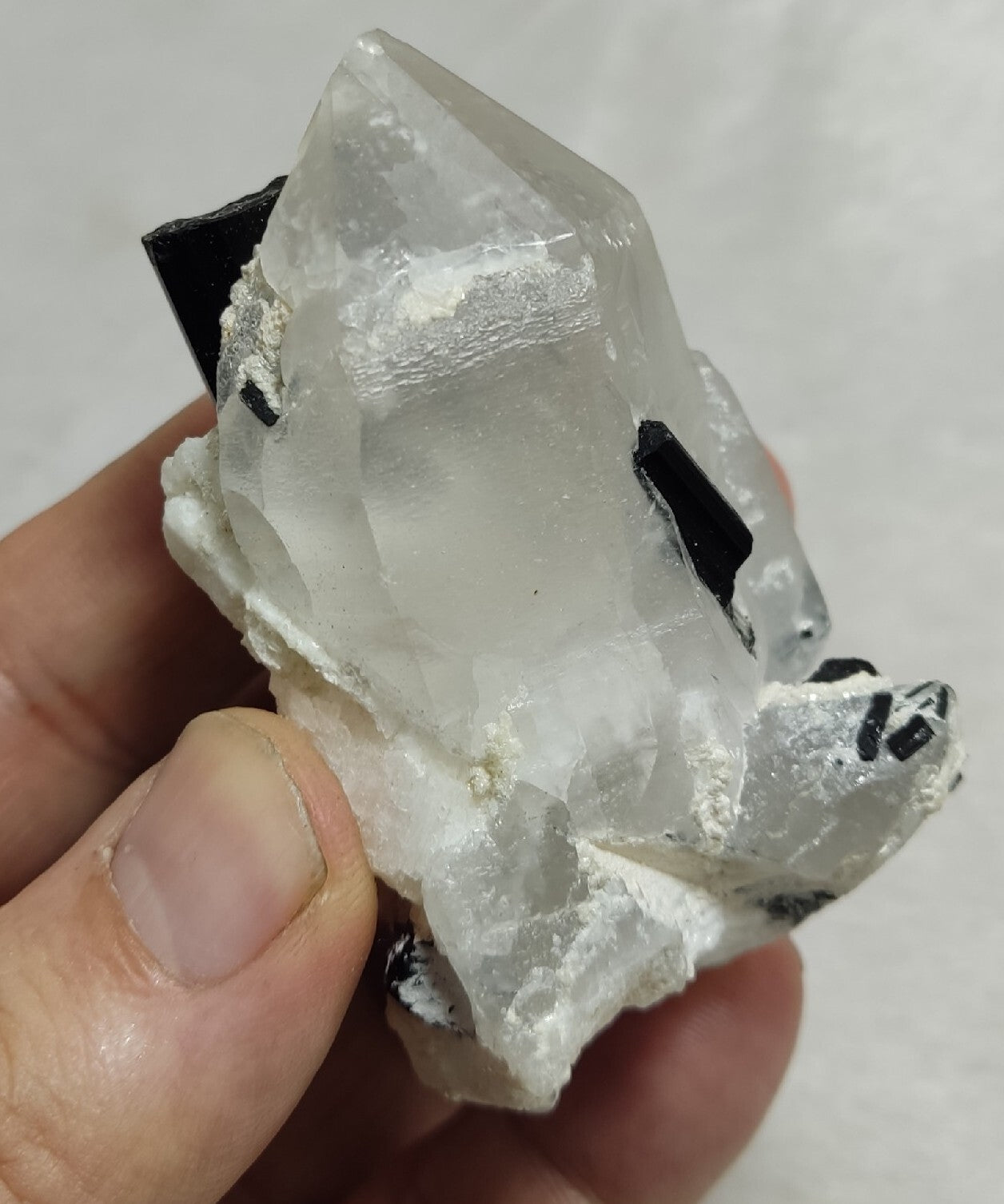 Natural quartz crystal with black tourmaline 145 grams