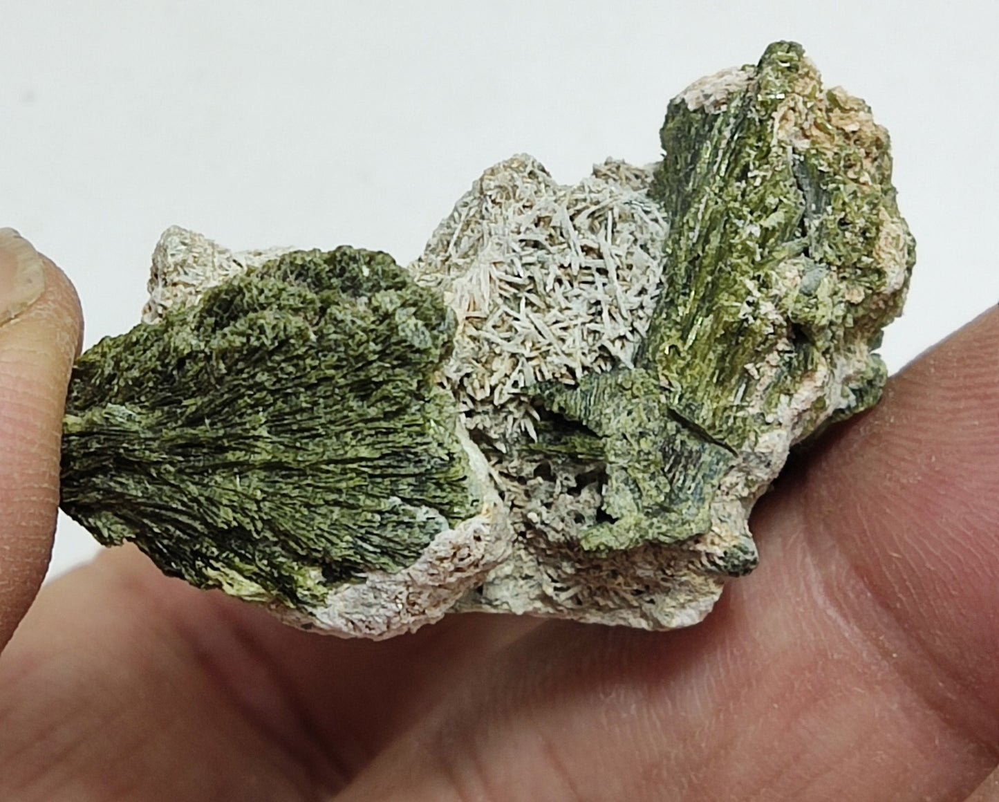 An aesthetic specimen of epidote crystal spray type 34 grams