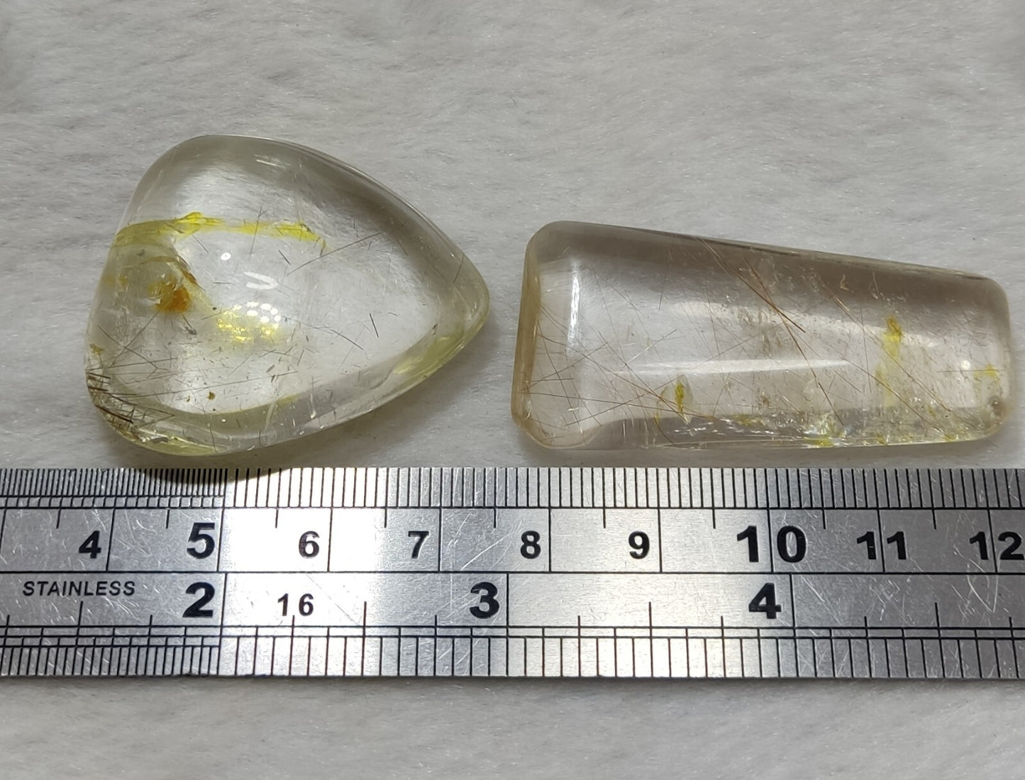 An amazing collection of 2 Rutilated polished quartz tumbles 46 grams