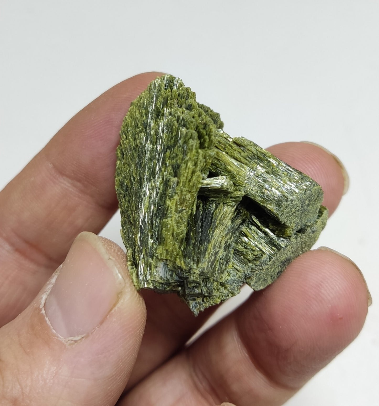 An aesthetic specimen of epidote crystal spray type 35 grams