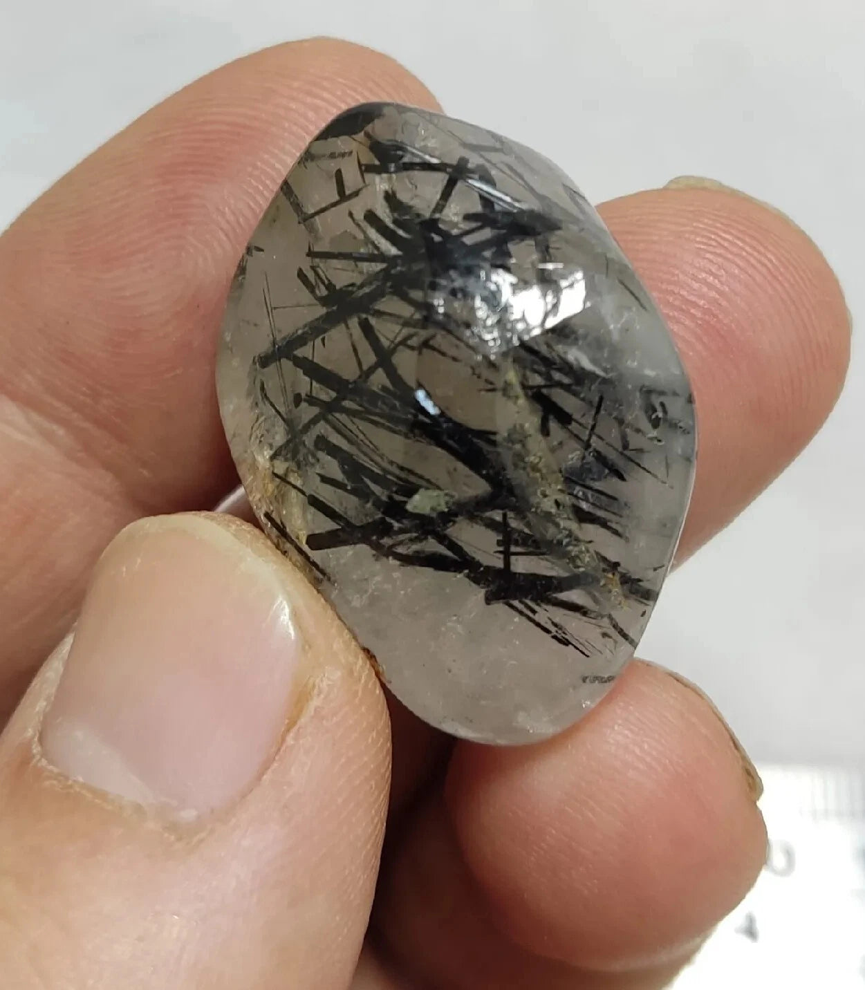 Rutiles/aegirine/ Unconfirmed quartz polished tumble 75 carats