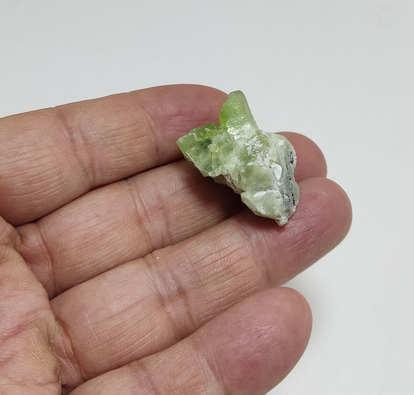 A aesthetic naturally terminated peridot crystal specimen 12 grams