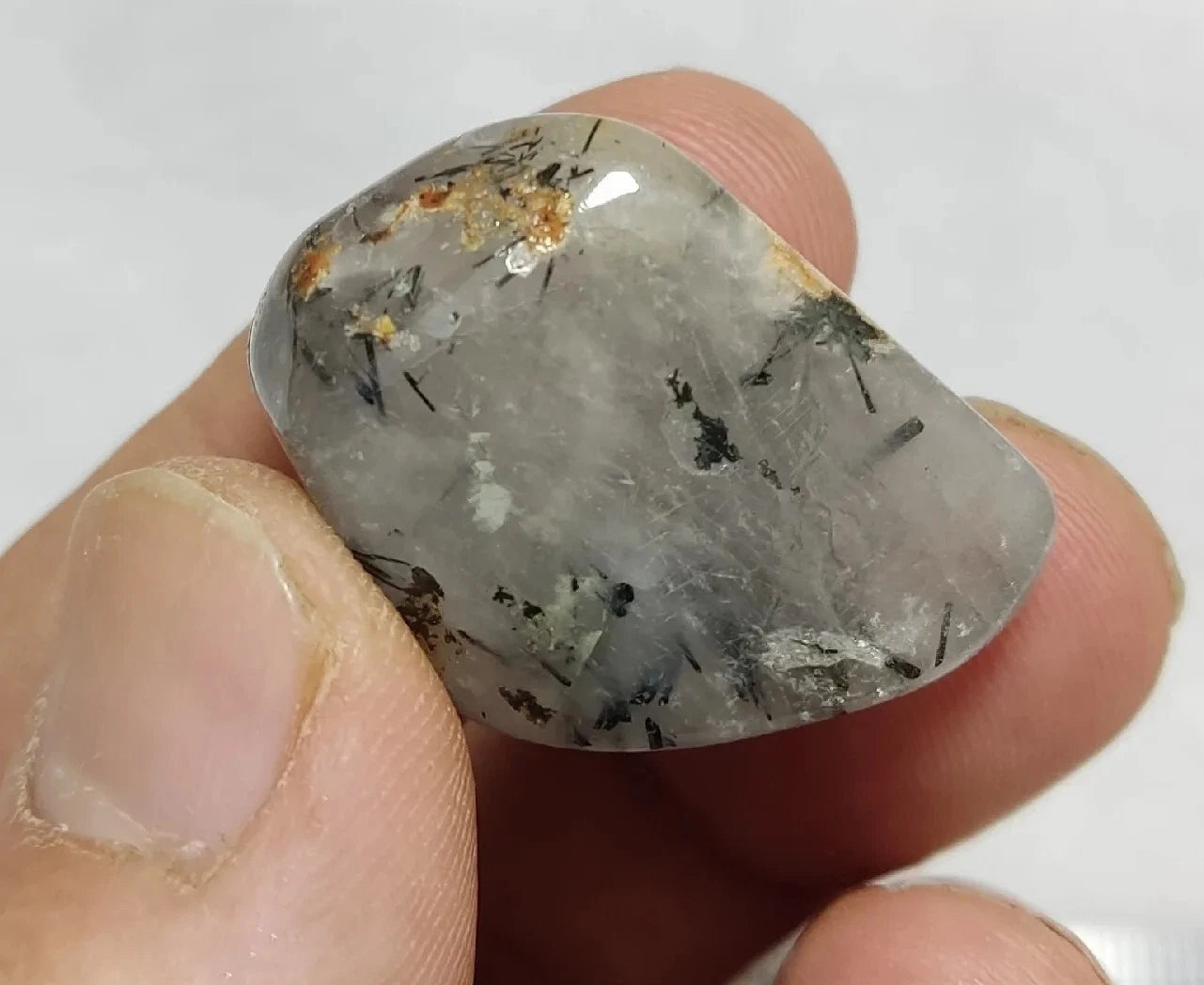 Rutiles/aegirine/ Unconfirmed quartz polished tumble 75 carats