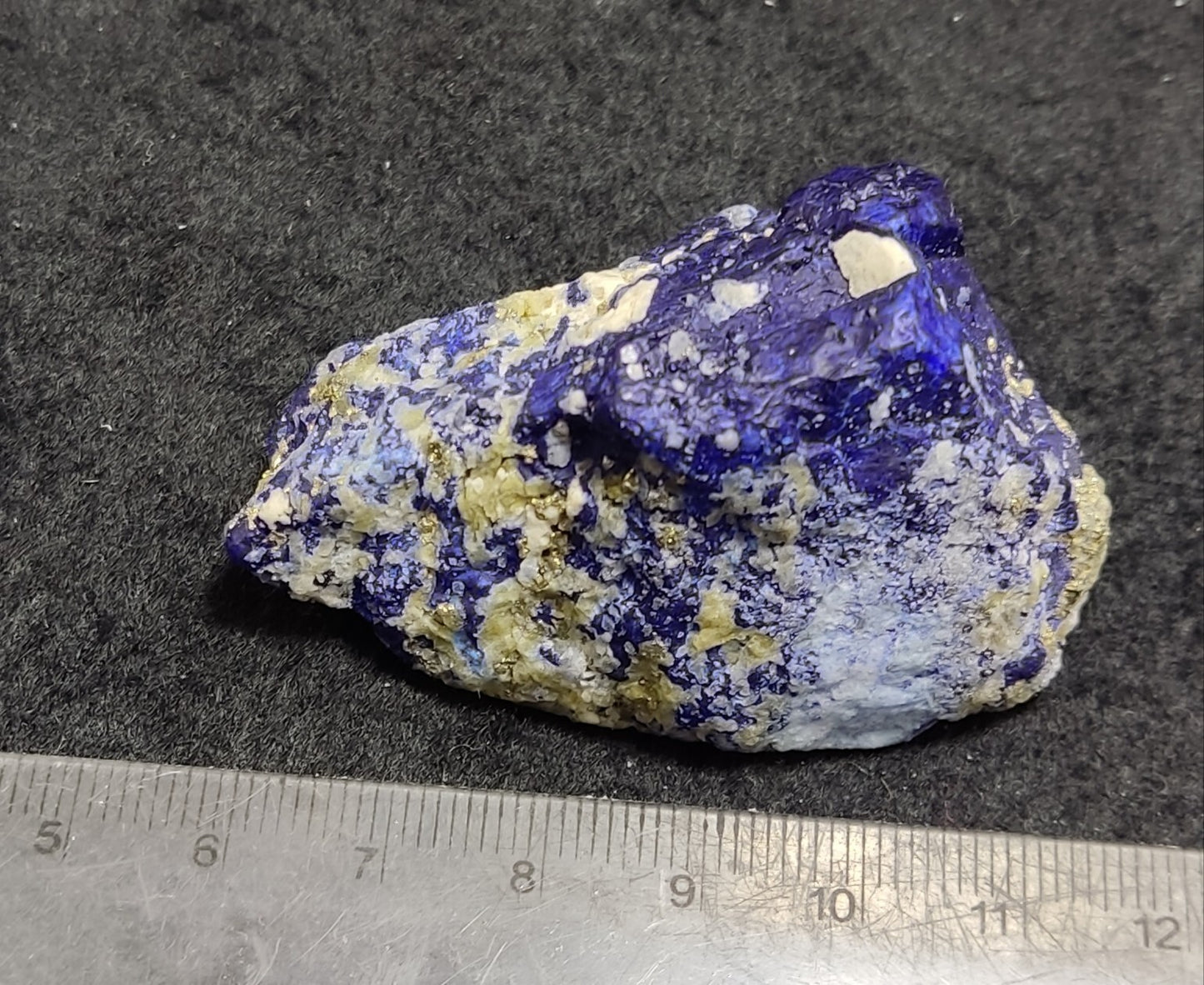 An Aesthetic specimen of fluorescent Lazurite with pyrite 65 grams