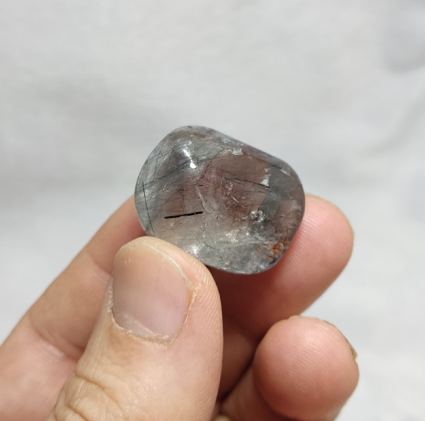 Single piece Rutiles/riebeckite/aegirine included quartz tumble 94 carats