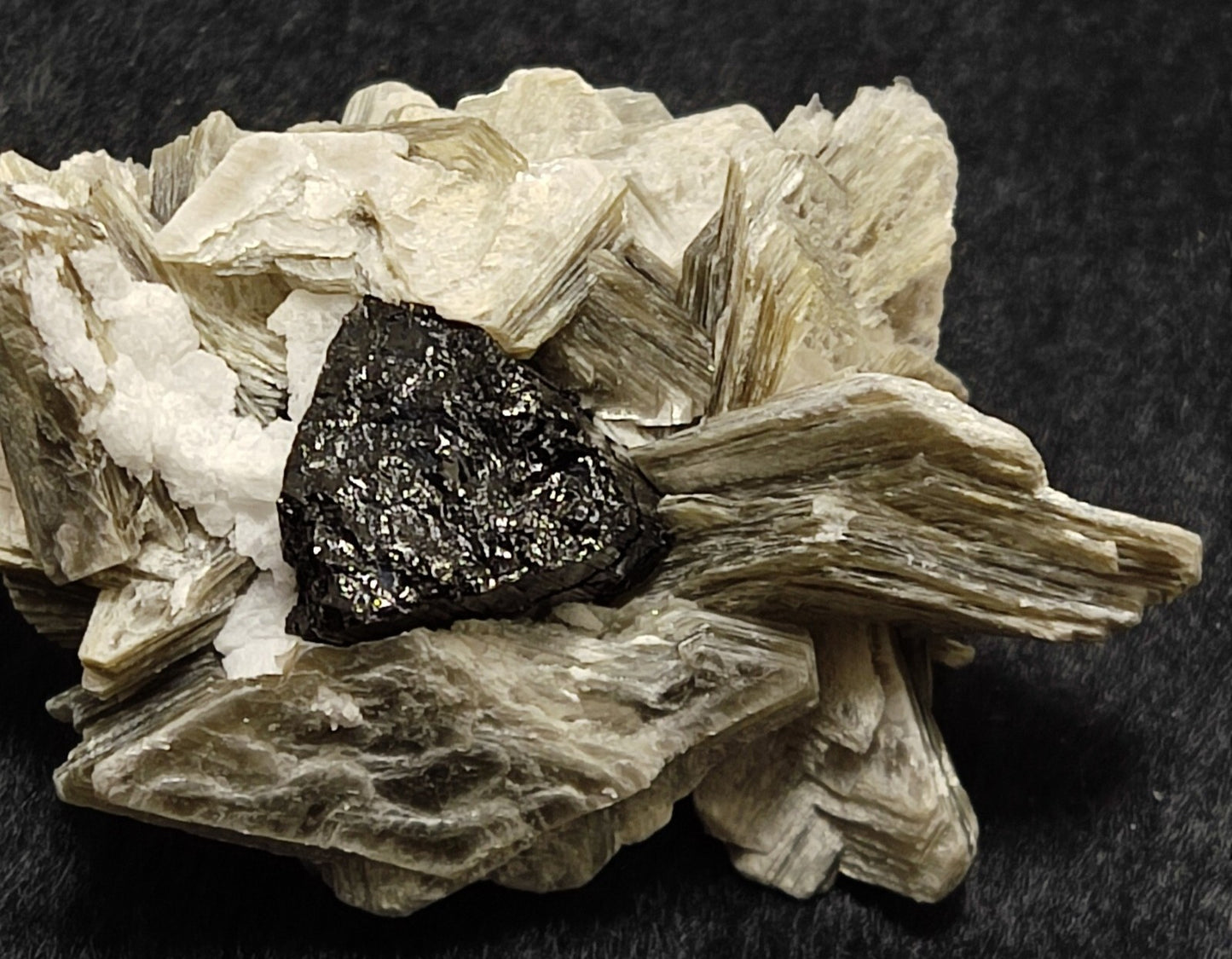 An Aesthetic specimen of muscovite with Tourmaline and albite 27 grams