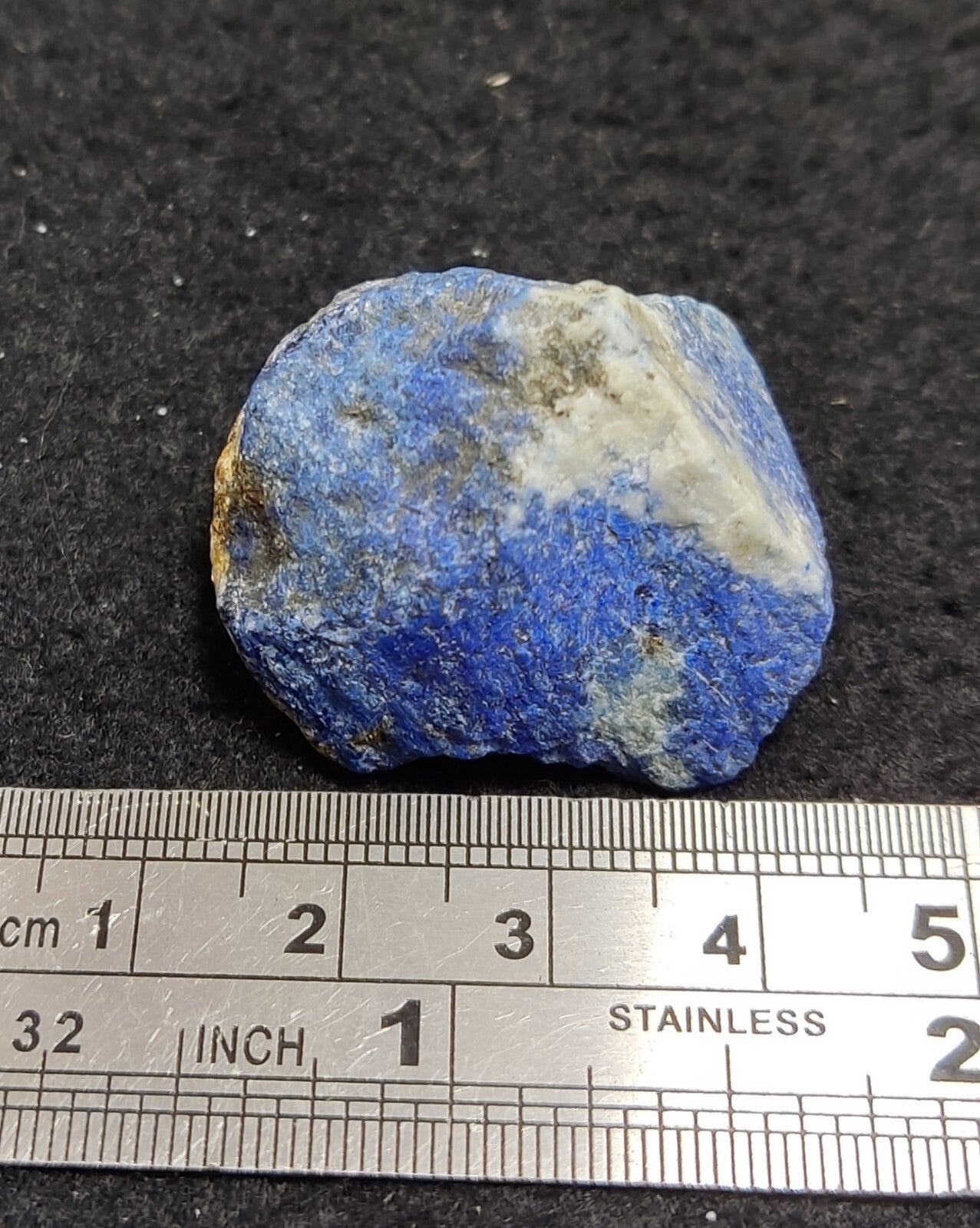 An Aesthetic specimen of fluorescent lapis/lazurite on matrix 23 grams