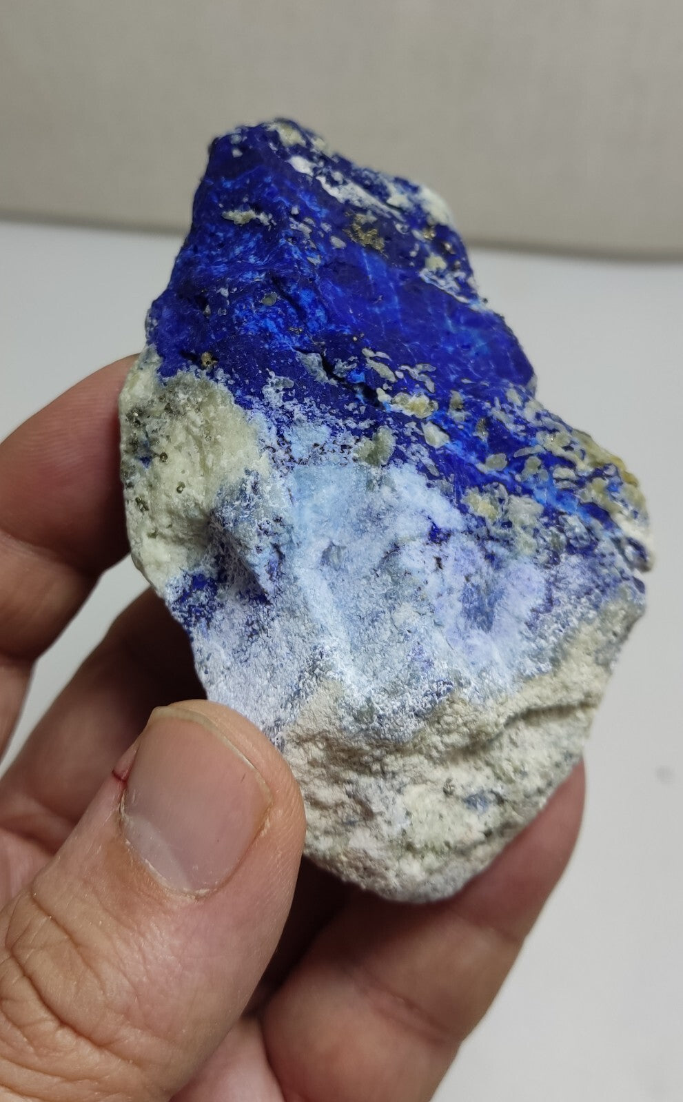 An Aesthetic specimen of fluorescent Lazurite with Pyrite 128 grams