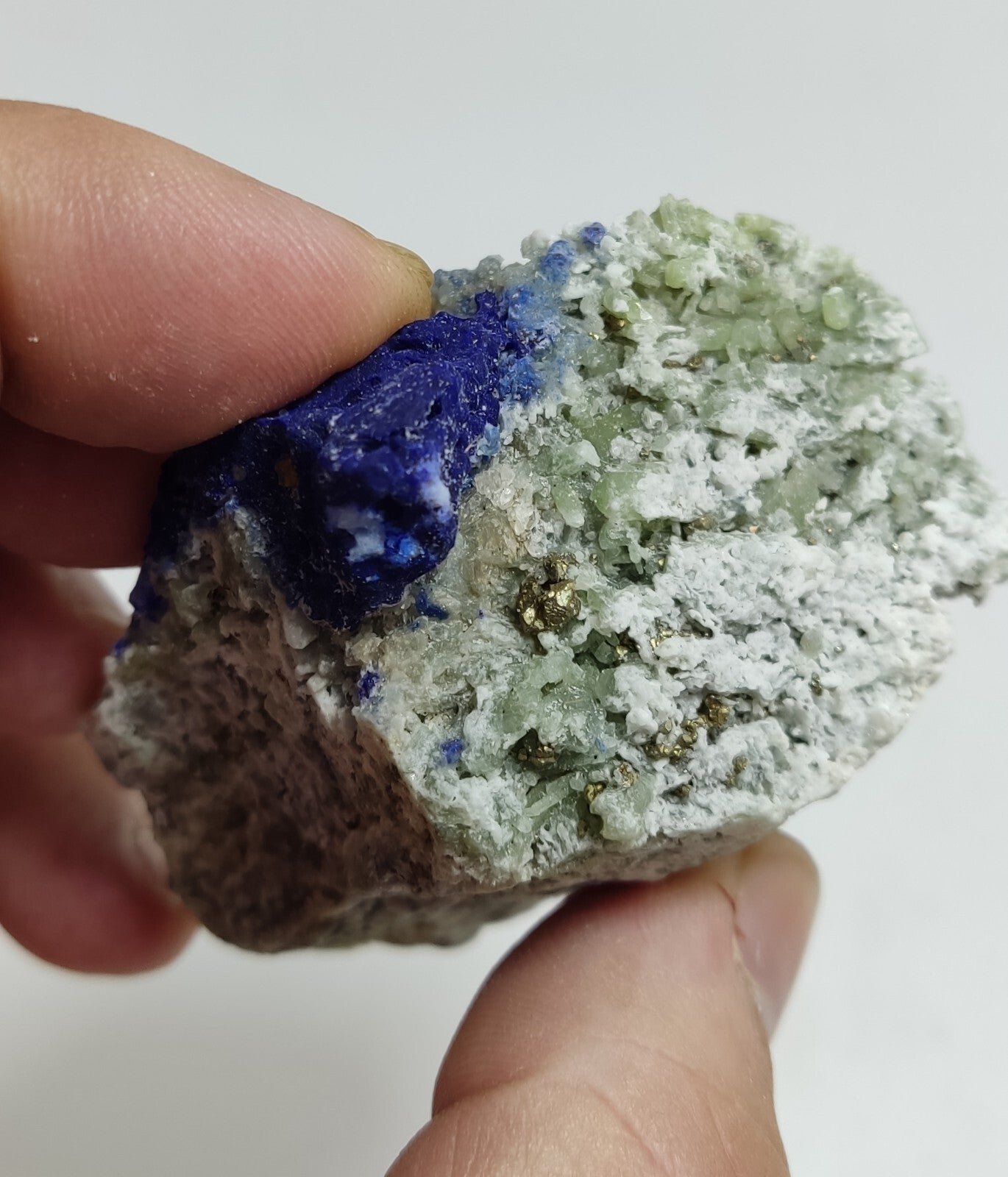 An Aesthetic specimen of fluorescent Lazurite with pyrite 181 grams