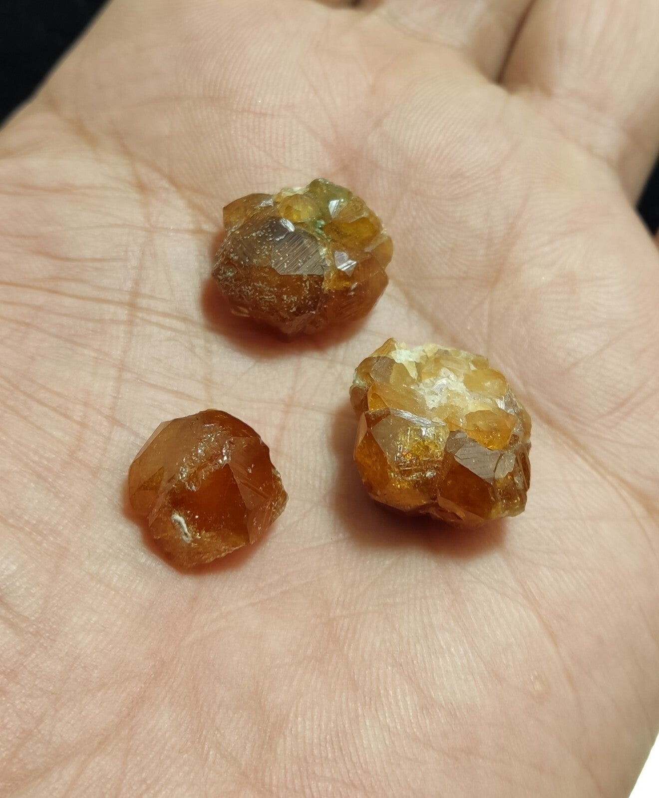A selection of three garnet variety hessonite crystals 14.8 grams