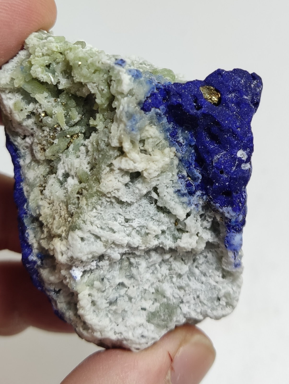 An Aesthetic specimen of fluorescent Lazurite with pyrite 181 grams