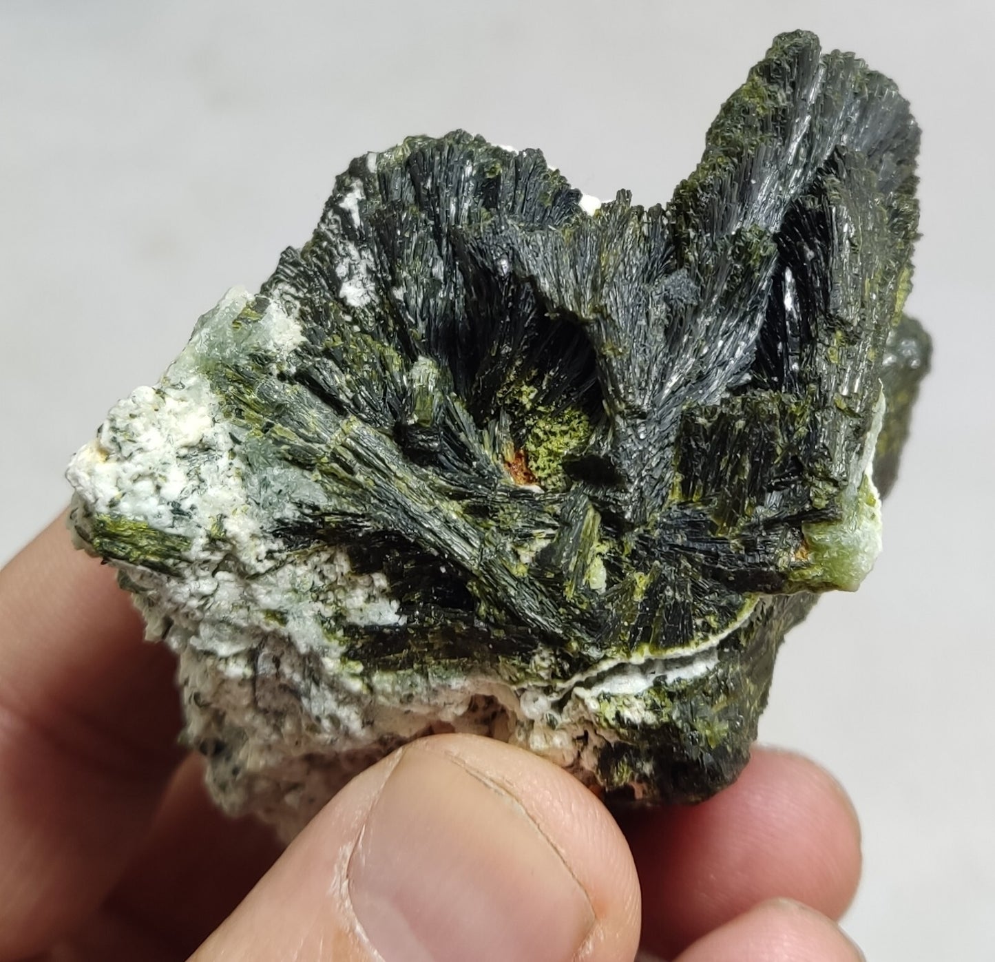 An aesthetic specimen of epidote crystal spray type on matrix 182 grams