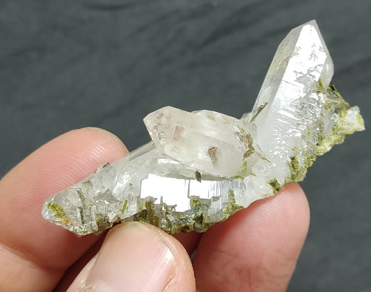 Natural Epidote inclusions in quartz cluster 19 grams