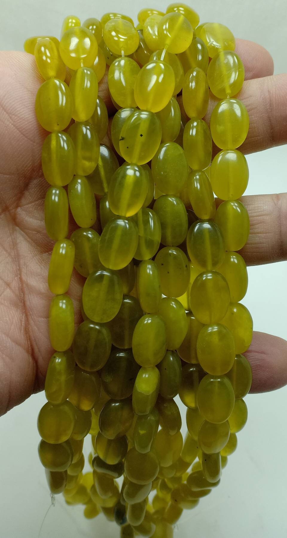 Single High Quality Serpentine drilled beads strand