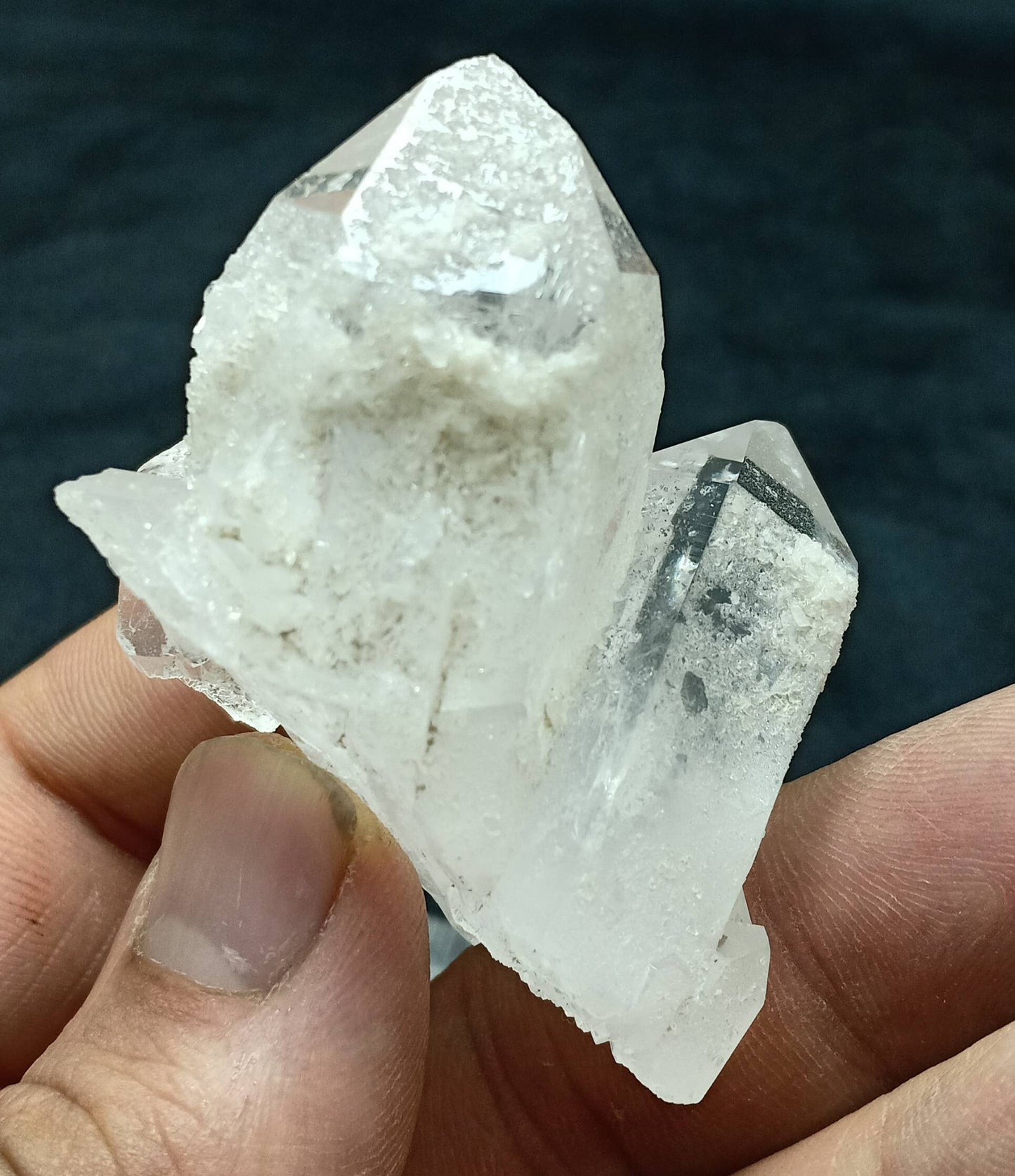 An amazing specimen of twin terminated Quartz Crystals with another small terminated Crystal attached 76 grams