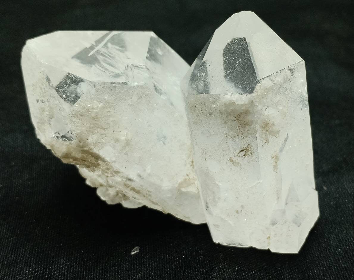 An amazing specimen of twin terminated Quartz Crystals with another small terminated Crystal attached 76 grams