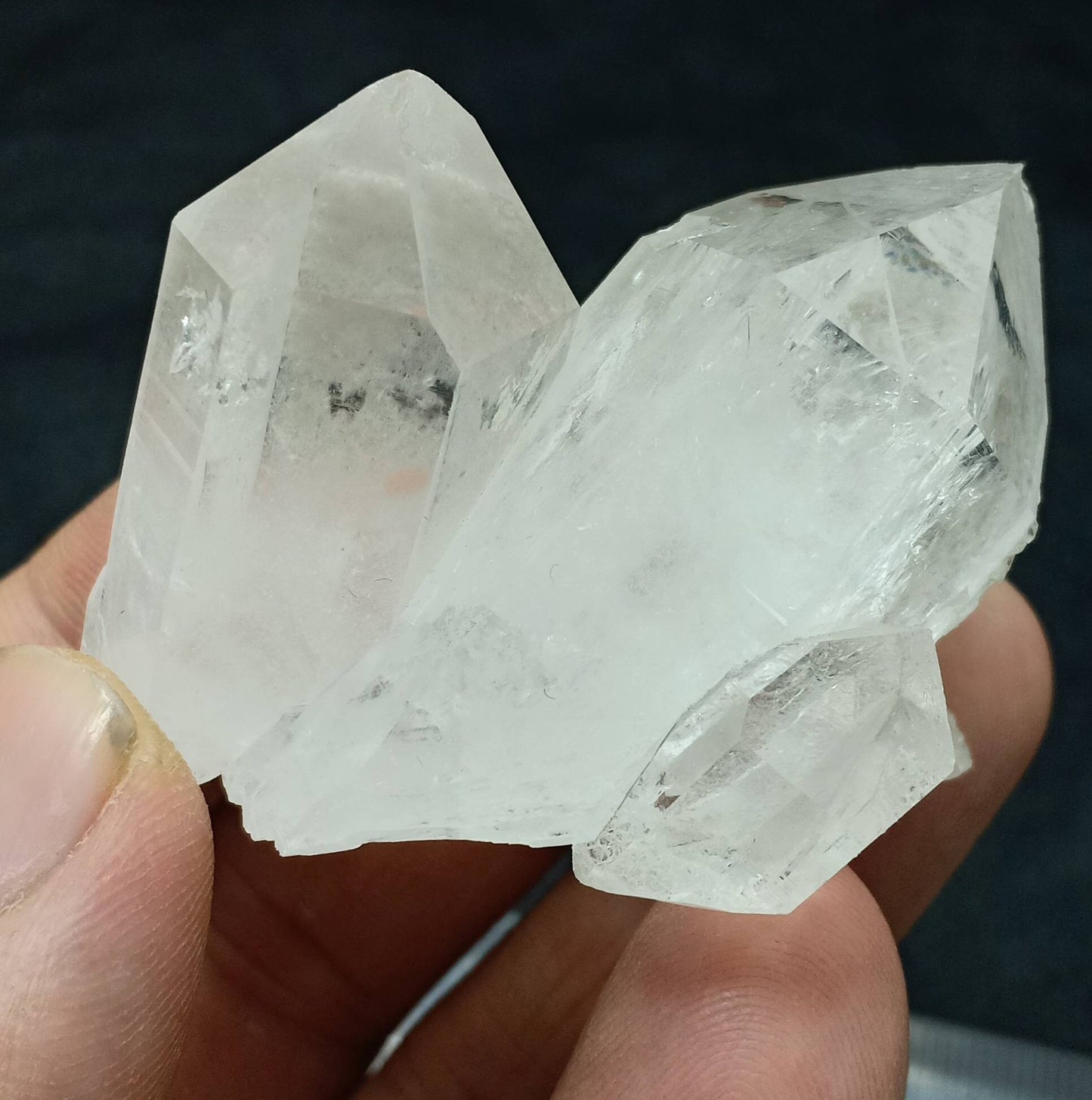 An amazing specimen of twin terminated Quartz Crystals with another small terminated Crystal attached 76 grams