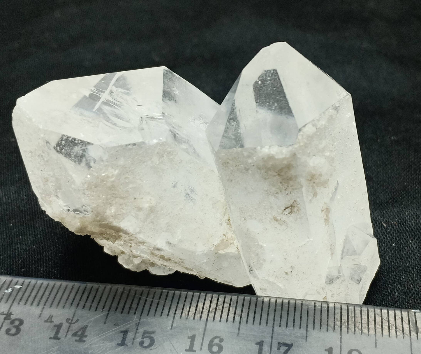 An amazing specimen of twin terminated Quartz Crystals with another small terminated Crystal attached 76 grams