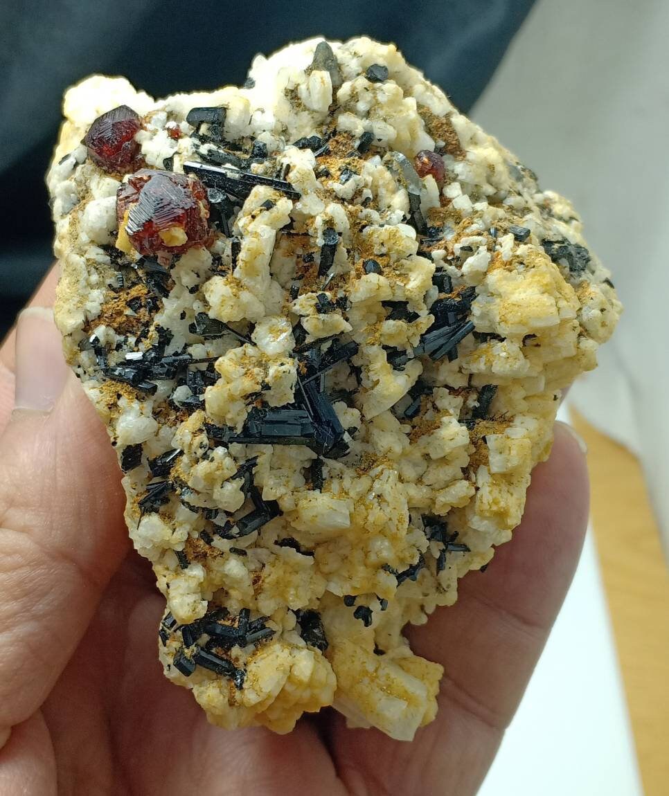 An amazing specimen of black Tourmaline crystals and etched spessartine crystals on matrix of Albite 248 grams
