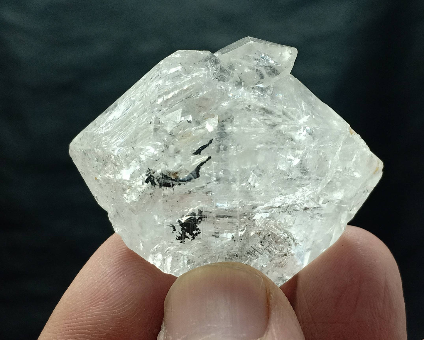 An amazing double terminated diamond like quartz crystal with carbon inclusions 57 grams