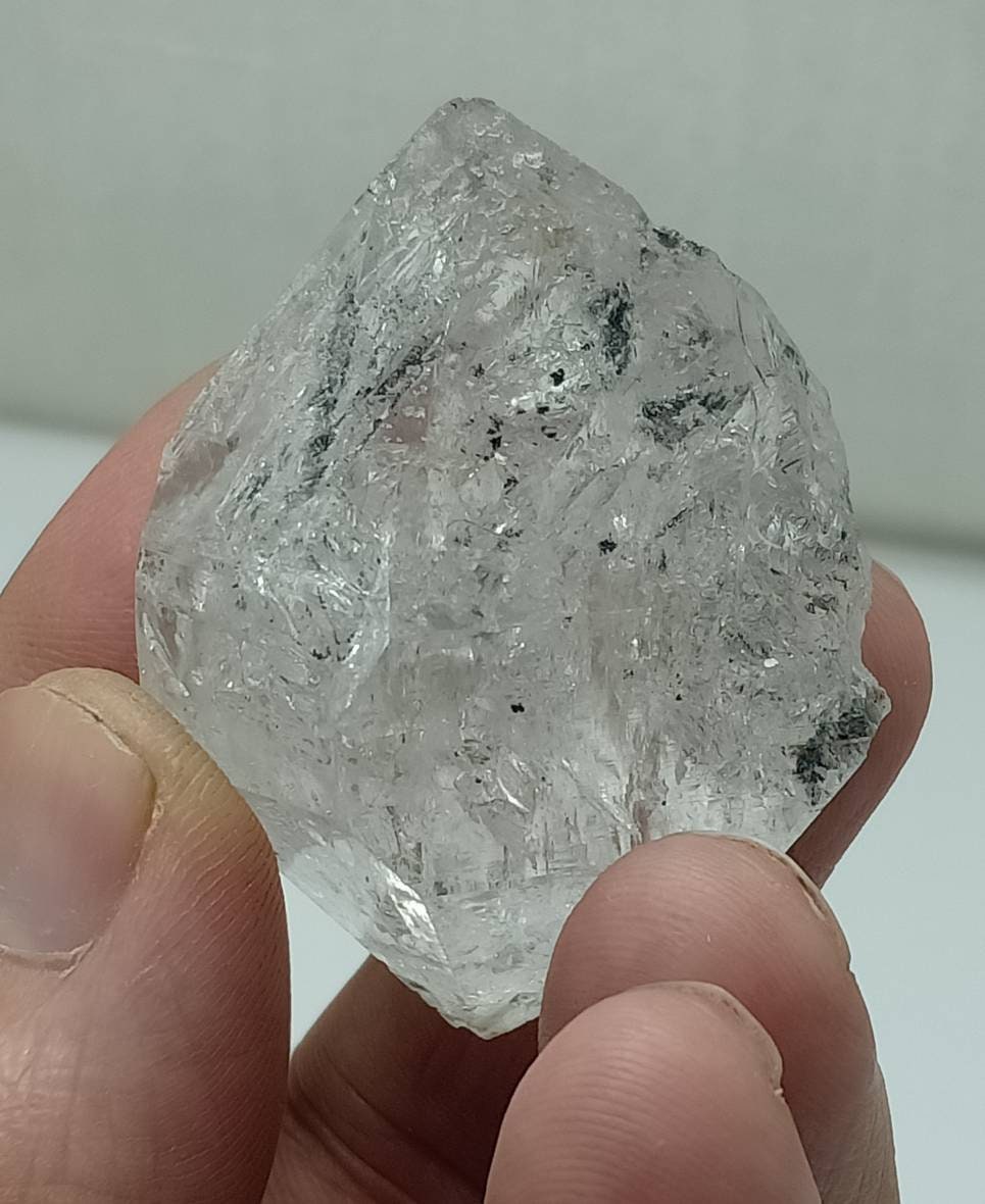 An amazing double terminated diamond like quartz crystal with carbon inclusions 57 grams