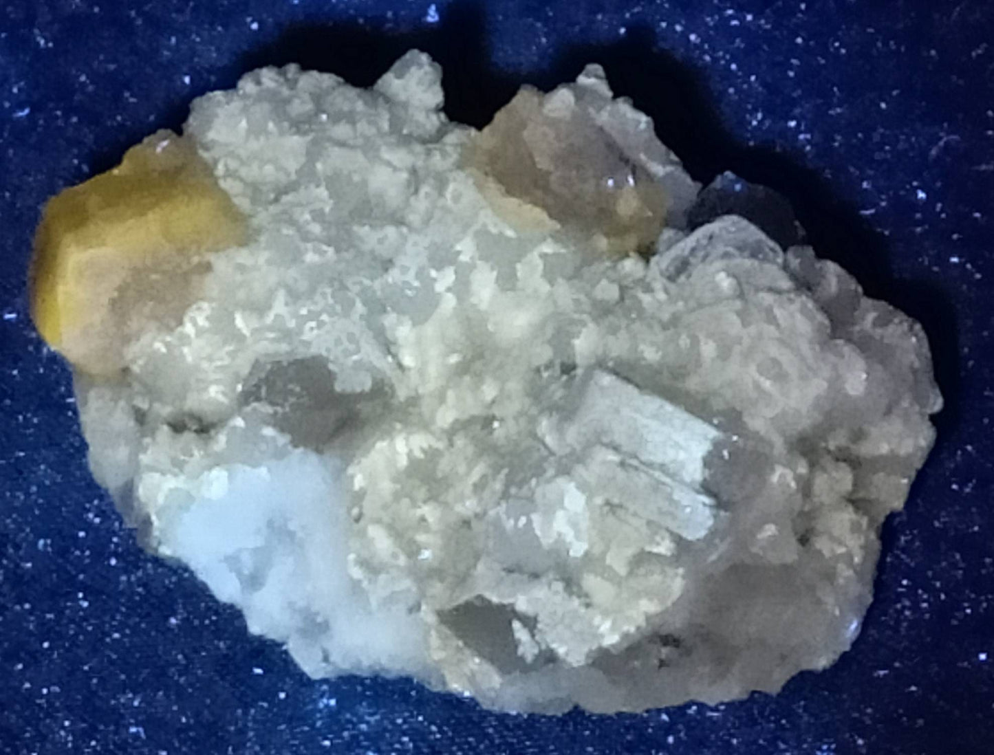 Fluorescent Apatite on matrix with mica and quartz 57 grams