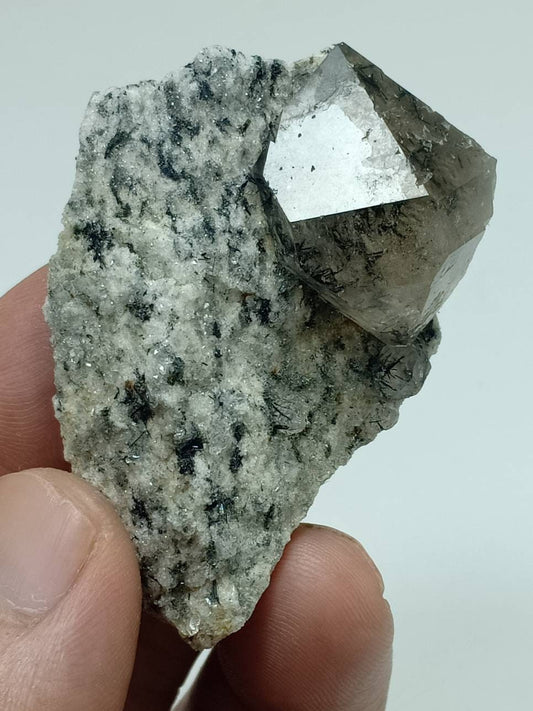 An amazing specimen of aegirine included double terminated Quartz Crystal on matrix of granite 52 grams