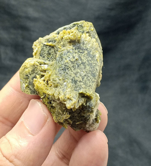 An amazing slightly etched Epidote cluster with beautiful terminations 78 grams