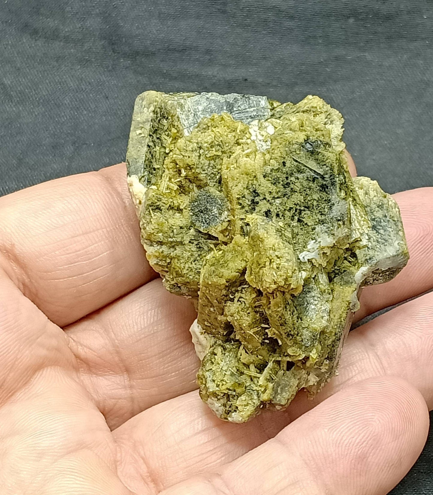 An amazing slightly etched Epidote cluster with beautiful terminations 78 grams