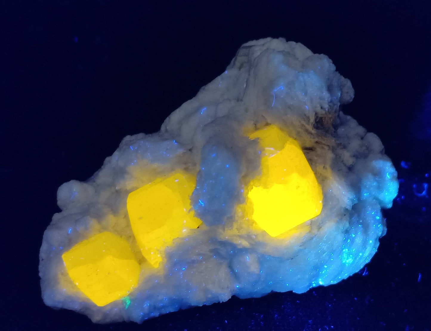 An amazing specimen of Fluorescent Apatite on matrix with mica 208 grams